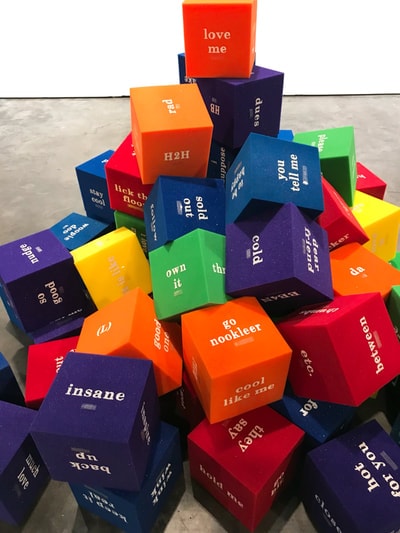 Large colorful word cubes stacked — community installation