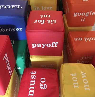 Small colorful word cubes — community installation detail