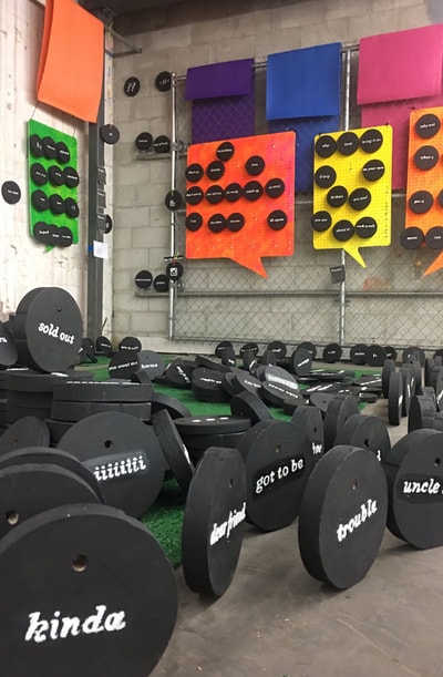 PRE_TEXTING — full garage installation with colorful speech bubbles and disc floor